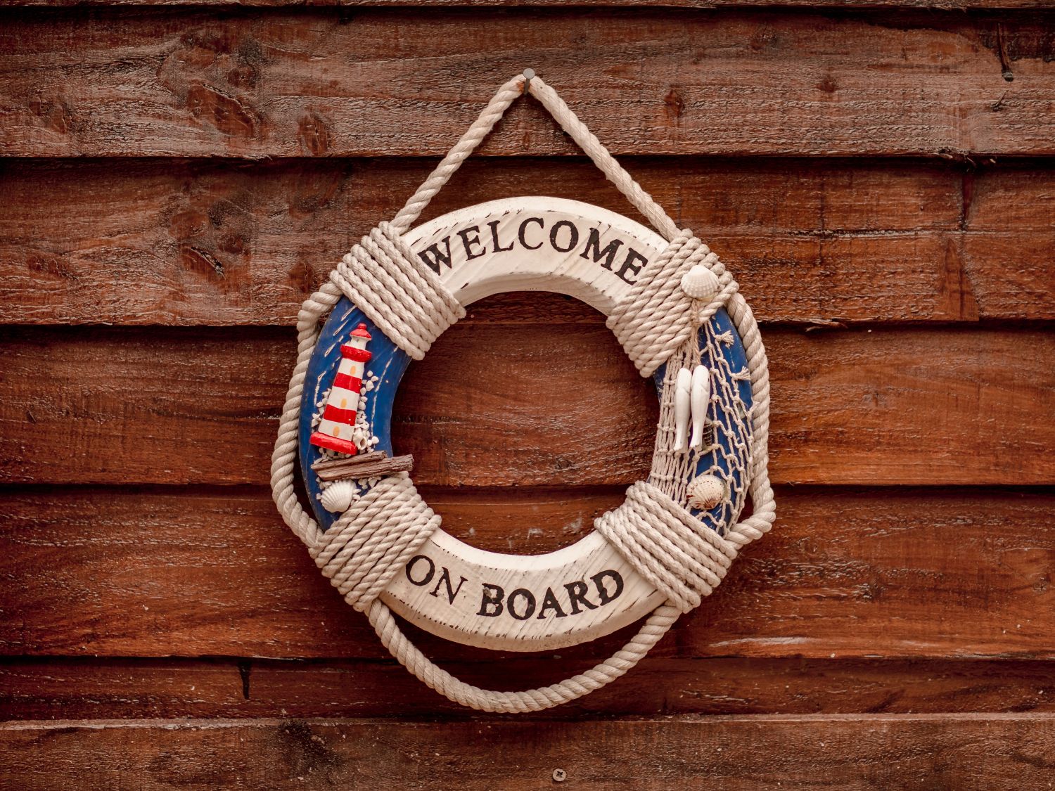 Wooden hollow circle with welcome on board signage