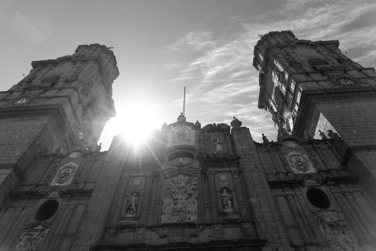 View of a cathedral from the outside in the daylight in black and white