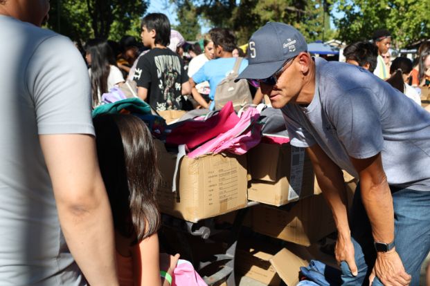 Mayor McCarty distributing backpacks