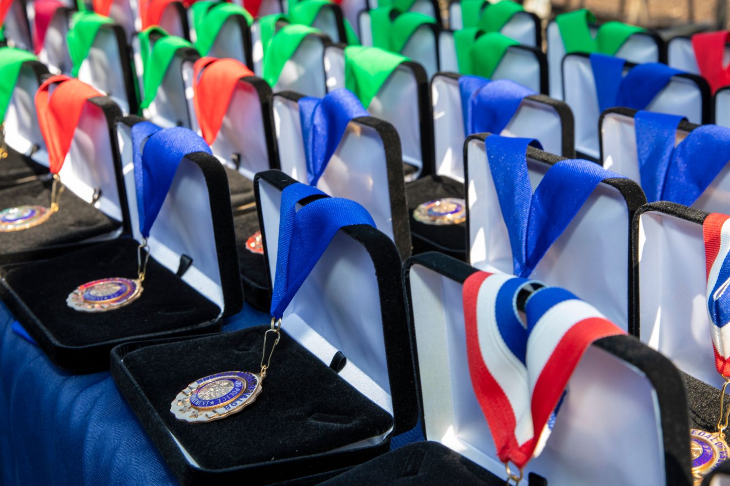 Photo of commendation award medals with ribbons in boxes on a table