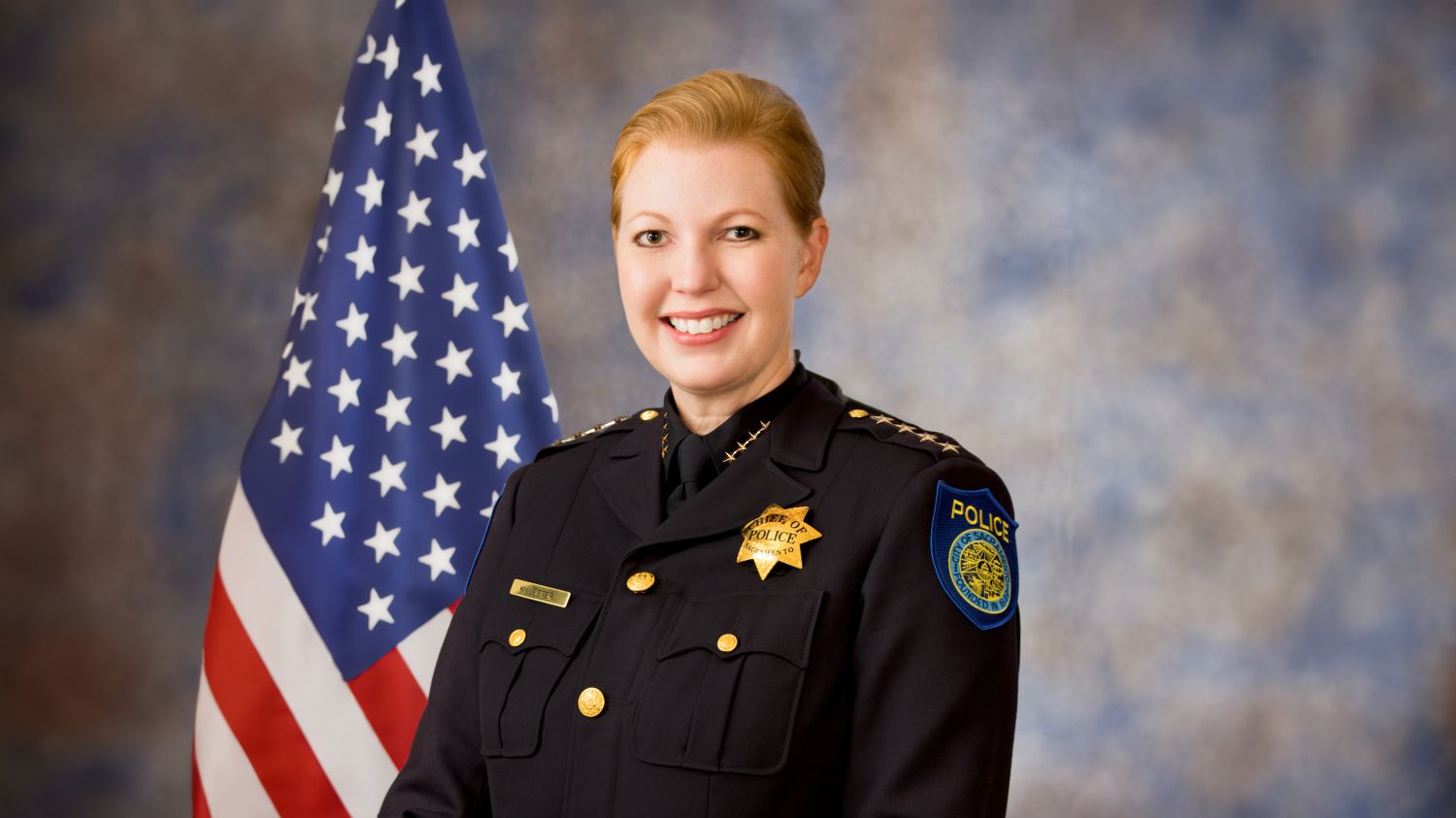 A portrait photo of the Sacramento Police Department Chief of Police, Katherine Lester, in full class-A uniform