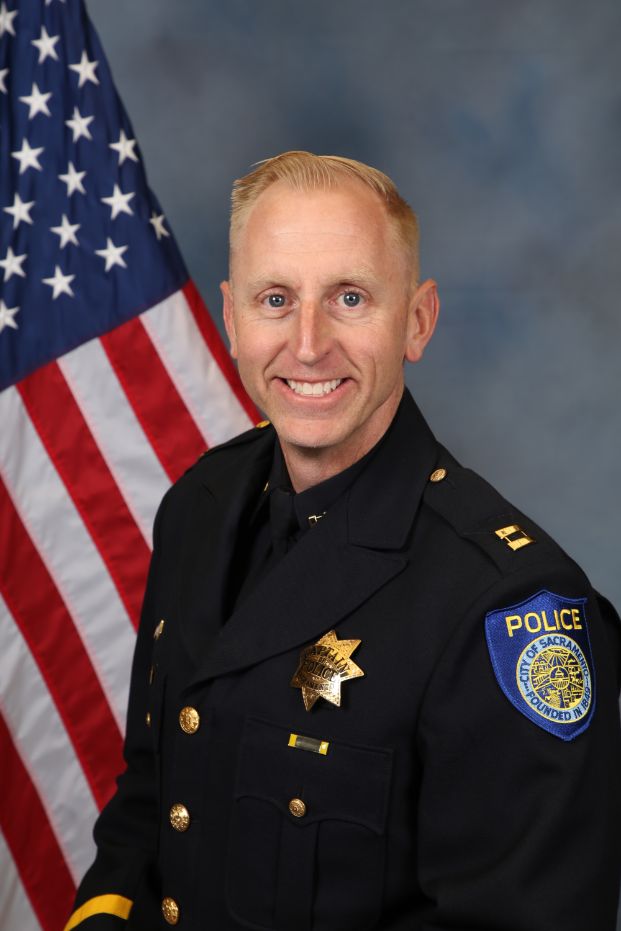 A portrait photo of the Sacramento Police Department Captain Zachary Bales, in full class-A uniform