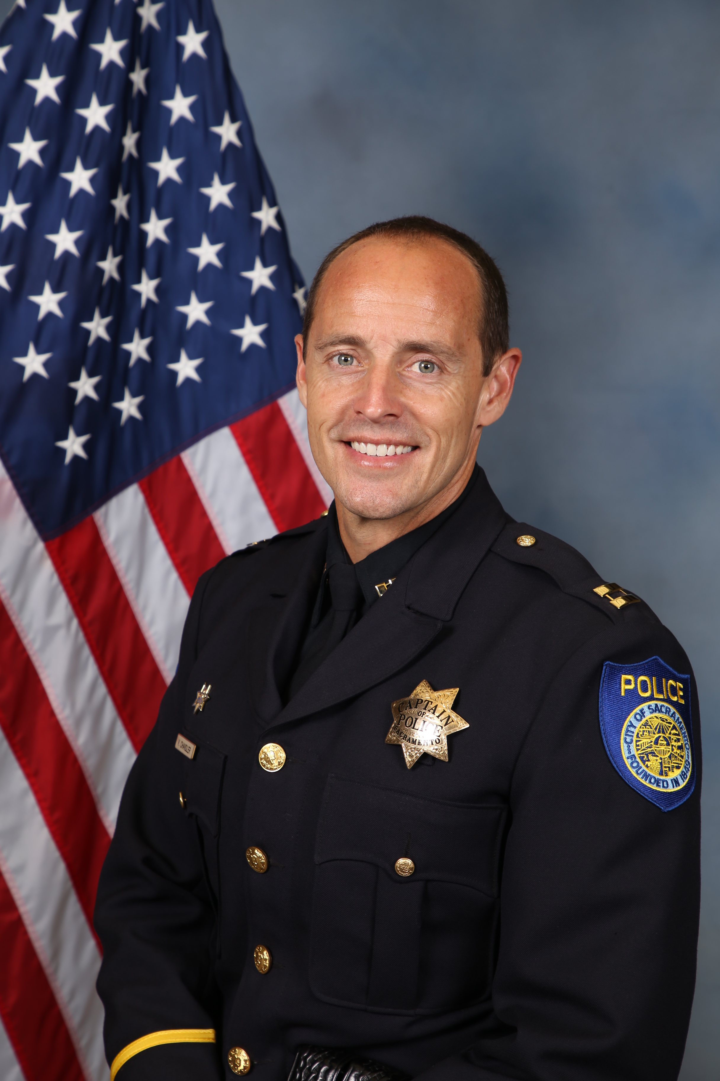 A portrait photo of the Sacramento Police Department Captain Vance Chandler, in full class-A uniform