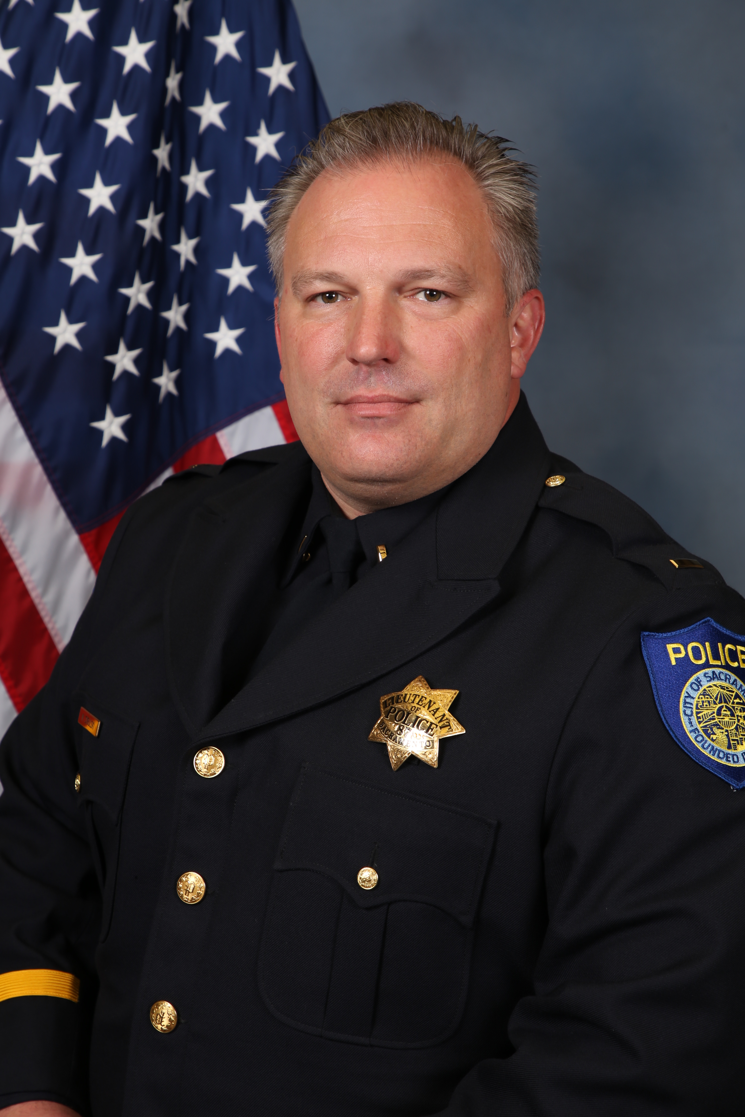 A portrait photo of the Sacramento Police Department Lieutenant Neil Cybulski, in full class-A uniform