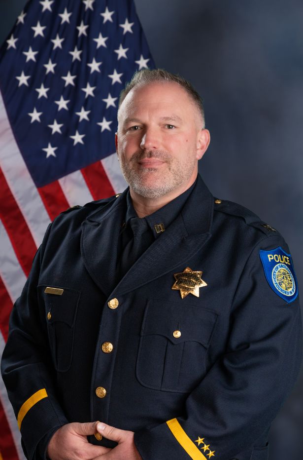 A portrait photo of the Sacramento Police Department Captain Neil Cybulski, in full class-A uniform