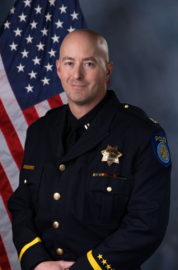 A portrait photo of the Sacramento Police Department Captain Robert Young, in full class-A uniform