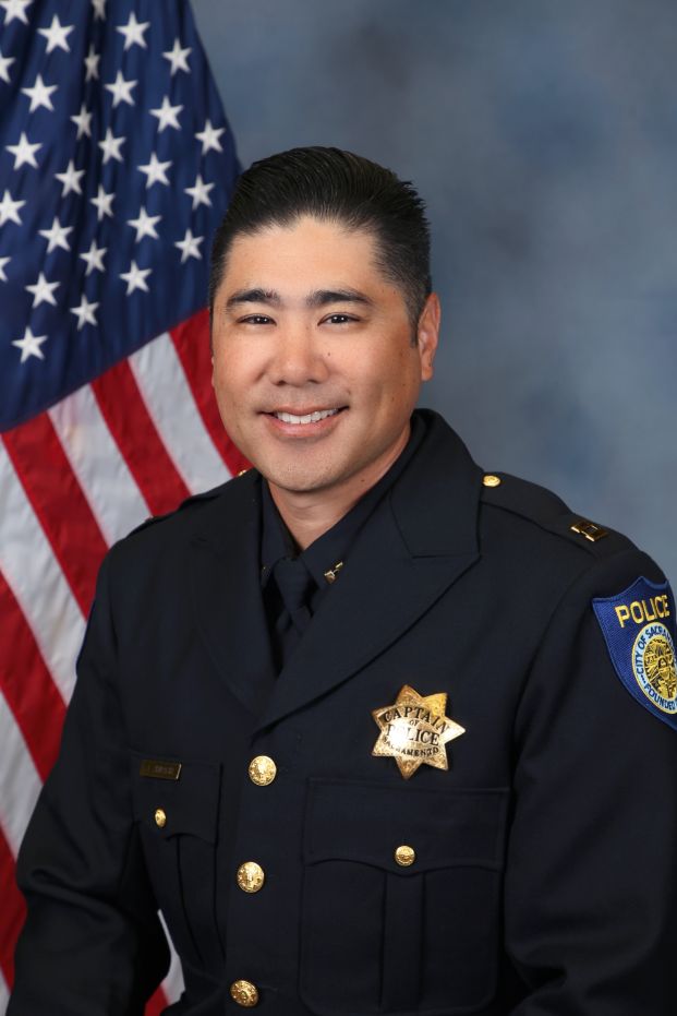 A portrait photo of the Sacramento Police Department Captain Jeffrey Shiraishi , in full class-A uniform