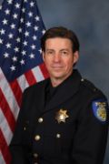 A portrait photo of the Sacramento Police Department Lieutenant Jason Start, in full class-A uniform
