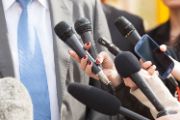 A photo of a microphone at a press conference