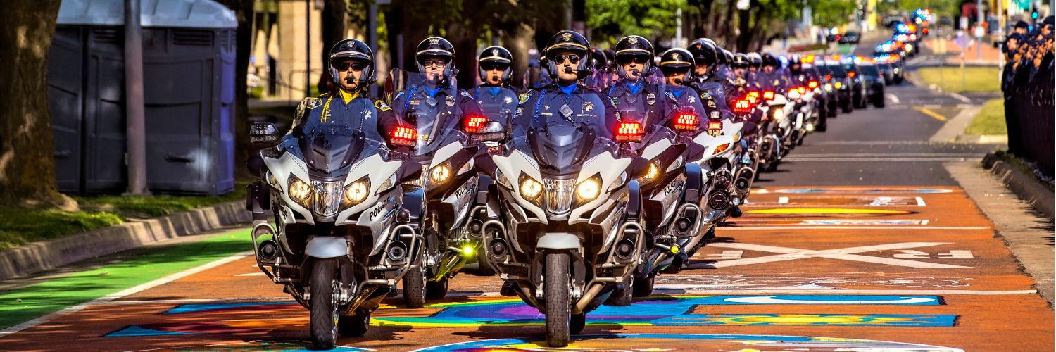 A photo of Sacramento Police Department motor units leading the annual California police memorial procession through downtown Sacramento.