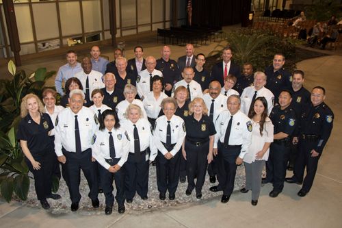 A photo of the Sacramento Police Department's volunteer participants, in full VIP uniform, from 2016. Taken in the Atrium of the Public Safety Admin Building.