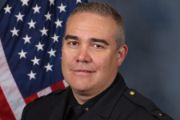 A portrait photo of the Sacramento Police Department Lieutenant Ryan Bullard, in full class-A uniform
