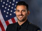 A portrait photo of the Sacramento Police Department Lieutenant Daniel DeLeon, in full class-A uniform
