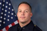 A portrait photo of the Sacramento Police Department Lieutenant Zachary Eaton, in full class-A uniform