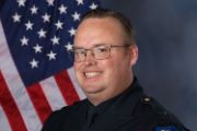 A portrait photo of the Sacramento Police Department Lieutenant Jared Kiser, in full class-A uniform