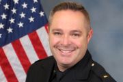 A portrait photo of the Sacramento Police Department Lieutenant Eddie Macaulay, in full class-A uniform