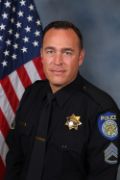A portrait photo of the Sacramento Police Department Lieutenant Brent Meyer, in full class-A uniform
