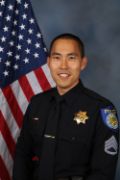 A portrait photo of the Sacramento Police Department Lieutenant Sang Park, in full class-A uniform