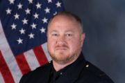 A portrait photo of the Sacramento Police Department Lieutenant David Putman, in full class-A uniform