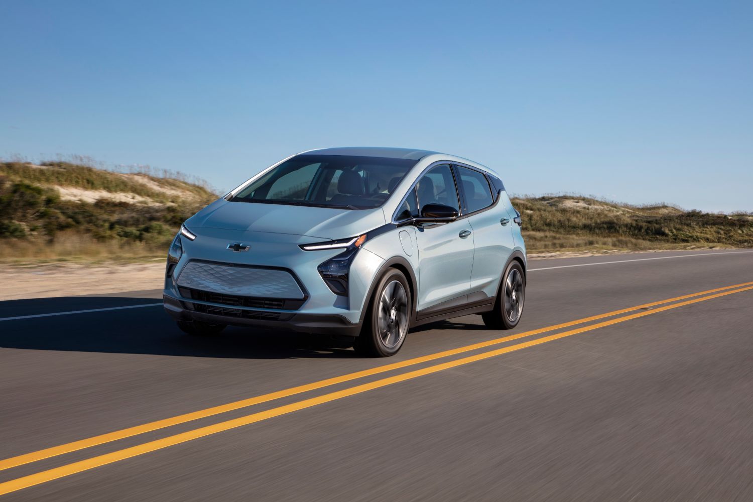 2022 Chevrolet Bolt EV driving on an open road. 