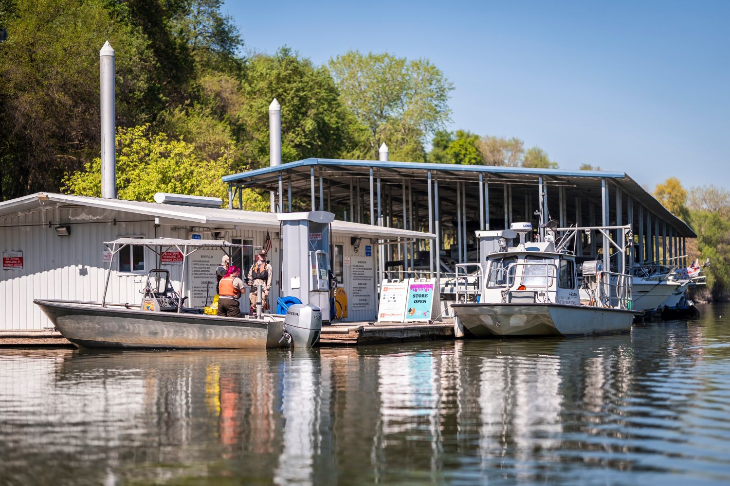 Image of person fueling boat