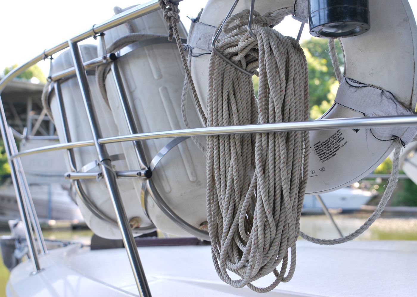 Image of a buoy and rope on the side of a white boat