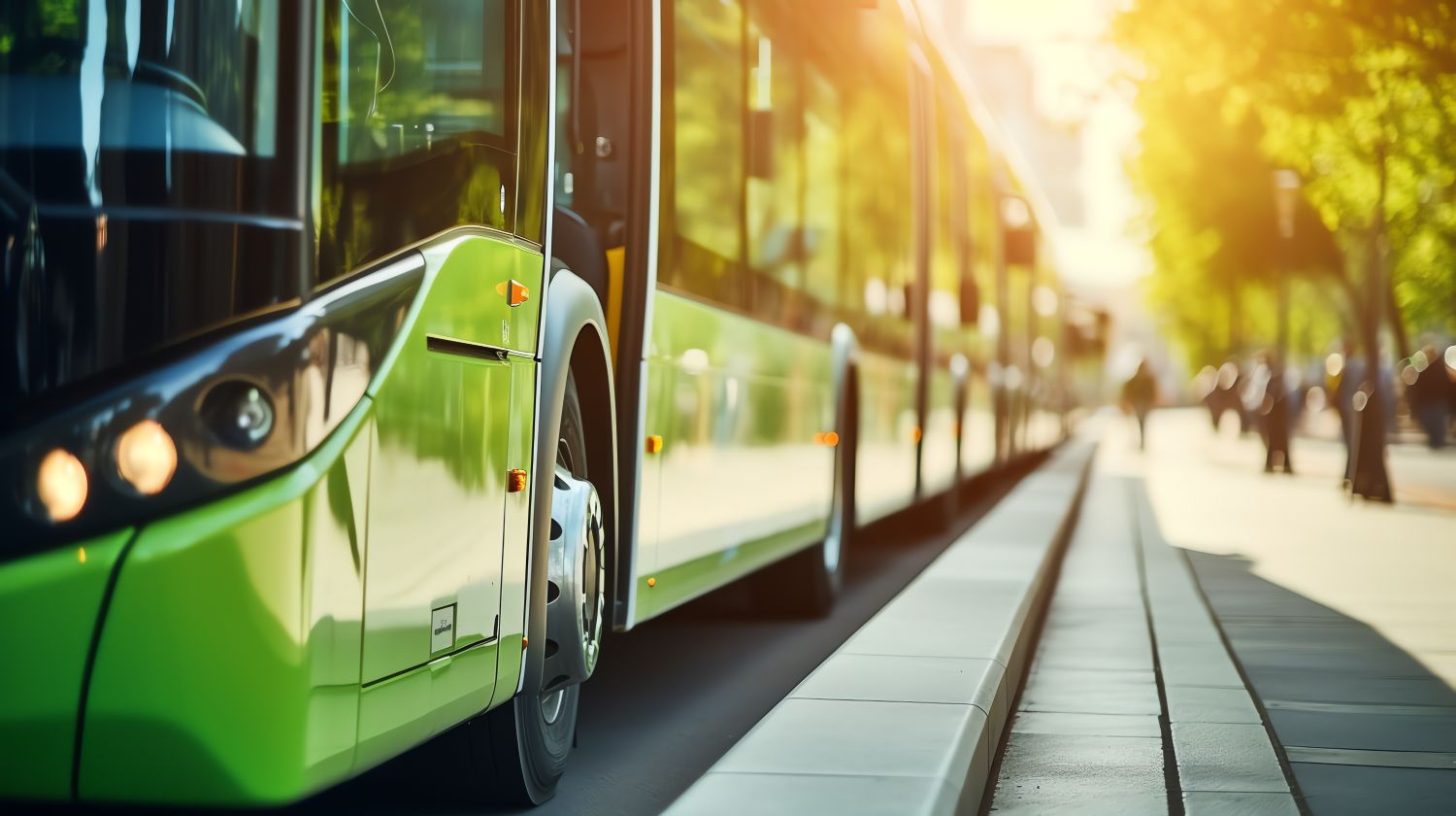 Image of green buses parked on the street