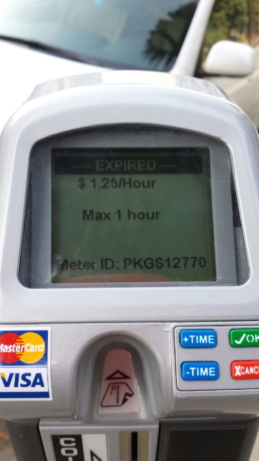 Image of smart parking meter screen showing rate and asset number