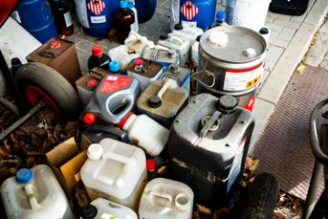 Hazardous Waste containers on the floor