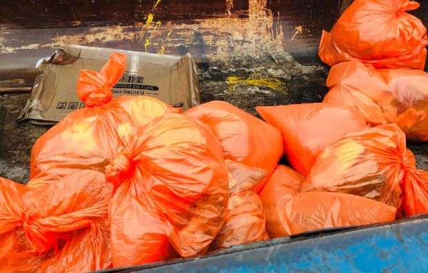 pile of orange garbage bags 