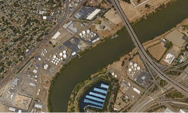 Aerial shot of the Broadway bridge including the surround homes and highways.