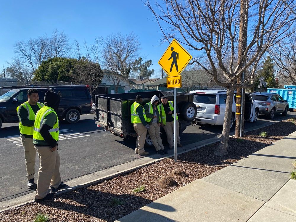 Dixieanne cleanup efforts with trash truck pick up members. 