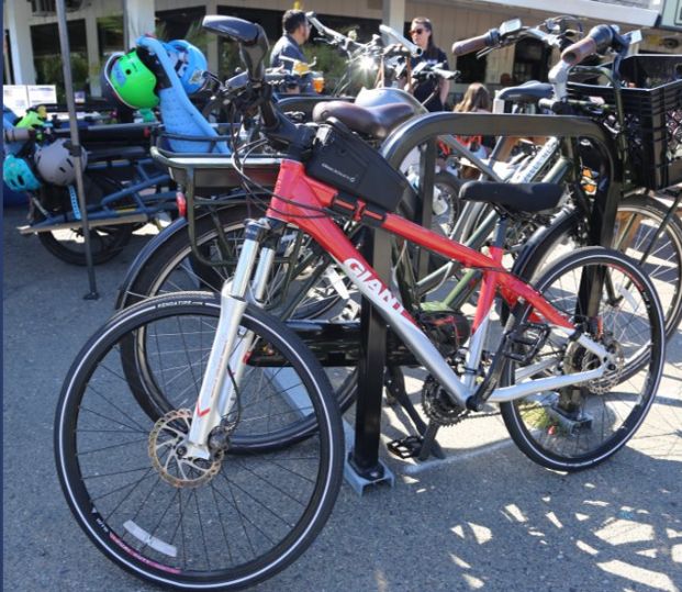 Photo of multiple bike racks with bikes parked on them