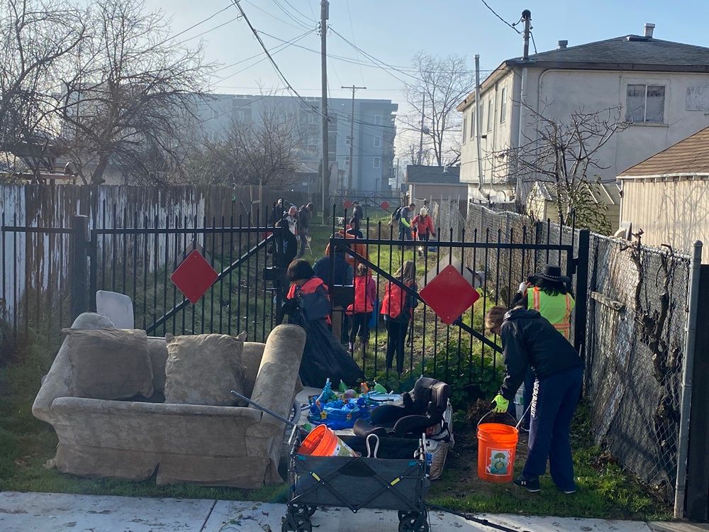 Dixieanne community cleanup efforts in a neighborhood alleyway.