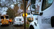 City of Sacramento Public Works trucks outside with trees in the background