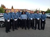 group of parking enforcement officers standing outside